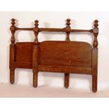 A pair of early Victorian stained pine bed ends headboard and footboard only,