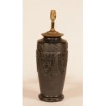 A Japanese black basalt pottery vase lamp, circa 1900, raised on carved wooden base,