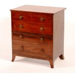 A George III mahogany night-table chest, circa 1790, with hinged top and false drawers,