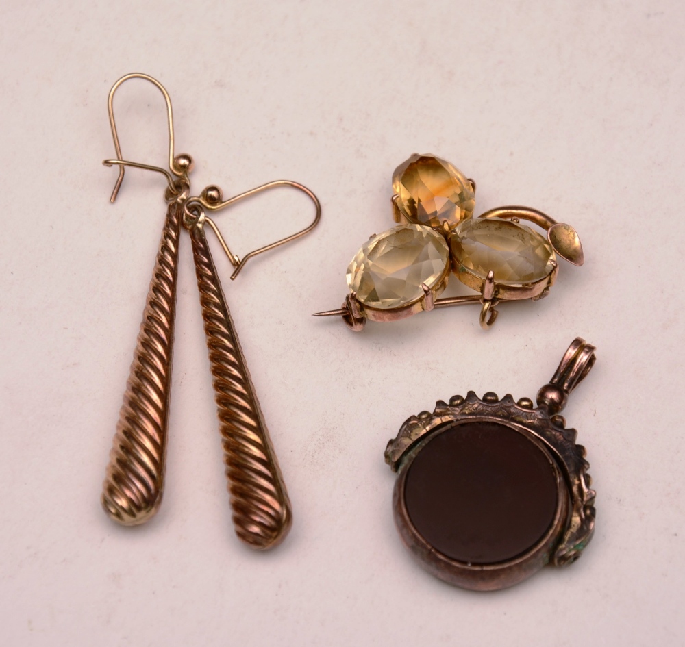 A 9ct gold citrine brooch, stamped 9ct, together with a pair of 9ct gold twist drop earrings,