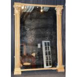 A George IV giltwood overmantel mirror, circa 1825, with pilaster uprights,