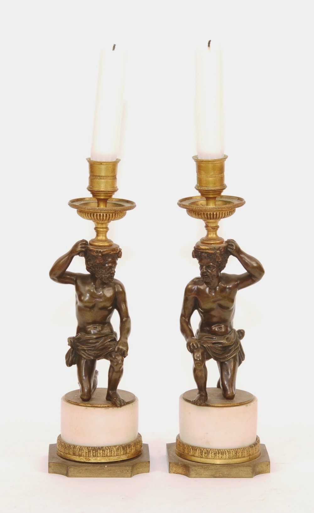 A pair of George III bronze and marble candlesticks, circa late 18th century,