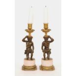 A pair of George III bronze and marble candlesticks, circa late 18th century,