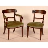 A set of six George IV mahogany dining chairs, circa 1820, including a carver armchair,
