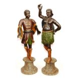 A pair of Italian Blackamoor figures, circa early 18th century, in the form of a male and female,