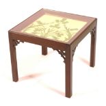 A mahogany tile topped occasional table, circa 1900, with fretwork brackets, made for twining,