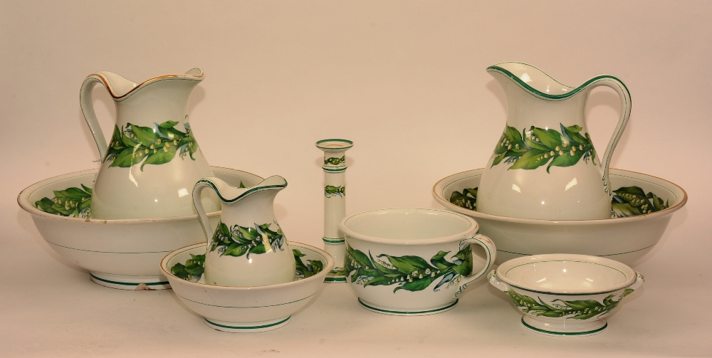 A Minton toilet set, comprising of two wash bowls, two jugs, small bowl and jug, candlestick,