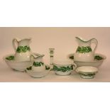A Minton toilet set, comprising of two wash bowls, two jugs, small bowl and jug, candlestick,