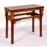 A 19th century Chinese altar table, with red-painted decoration,