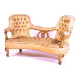 A Victorian giltwood sofa circa 1850, with buttoned double chair-back and buttoned seat,