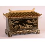 A chinoiserie lacquered casket circa 1920, in the form of a Chinese temple, with detachable lid,