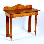 A Victorian console table, with shaped pediment,