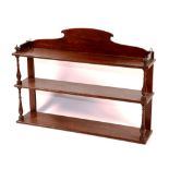 A set of early Victorian mahogany hanging shelves, circa 1830,