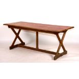 An Arts & Crafts oak refectory table, the rectangular top raised on X-form supports,