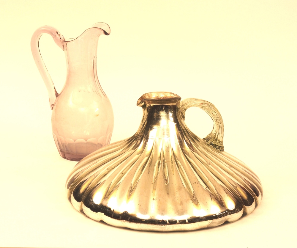 A silvered glass flagon, circa late 19th century, with wide base, 23cm high,