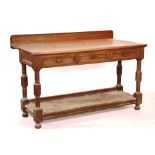 A Victorian oak buffet/serving table, with three drawers above undertier,