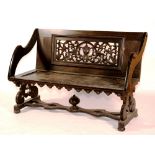 A Victorian ebonised bench, circa mid 19th century, with pierced panel to back,