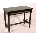 A late Victorian ebonised card table, enclosing felt lined interior, raised on turned supports,