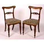 A set of six William IV rosewood chairs, circa 1830, with upholstered seats and reeded legs,