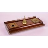 A 19th century mahogany inkstand, with brass receivers and bell,
