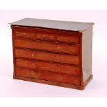 A tooled red leather collector's chest, in the form of a chest of drawers,