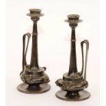 A pair of bronze candlesticks, circa 1860, in the form of neo-classical ewers,