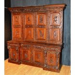 A large Victorian carved oak cupboard attributed to Thomas Tweedy of Newcastle Upon Tyne,