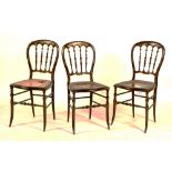 A set of four ebonised Japanned parlour chairs, circa 1850, bergere seats a/f,