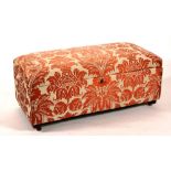 A Victorian upholstered Ottoman, with well within, raised on low legs,