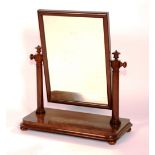 A Victorian mahogany dressing glass, circa 1870, with turned supports,