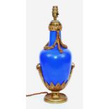 An ormolu mounted blue porcelain vase lamp, circa 1880, mounted with laurel swags,