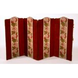 A Victorian velvet and needlepoint dressing screen, the four sections decorated with floral panels,