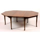 A George II mahogany octagonal library table, with additional leaf, raised on pad foot,