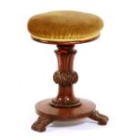 A Victorian mahogany revolving piano stool,