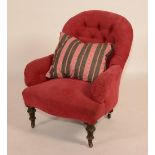 An upholstered low armchair, circa late 19th century, with serpentine front,
