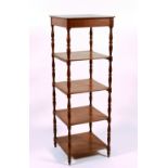 A Louis-Philippe oak etagere, circa 1835, with turned supports,