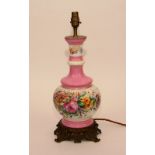 A porcelain vase lamp, circa 1890, decorated with floral banded panels, on ormolu pierced base,