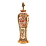 A 19th century Chinese famille rose vase lamp, circa 1840, decorated with figures and floral panels,