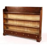 A faux rosewood open bookcase, above three drawers,