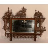 A fretwork overmantle mirror,