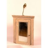 A painted corner cabinet, circa 19th century, with glazed door and brass adjustable lamp to top,