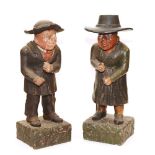 A pair of 19th century painted terracotta caricature figures, circa 1865,