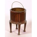 An 18th century Dutch mahogany jardiniere, circa 1785, with metal liner and swing handle,