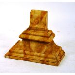 A faux marble wall bracket, of ogee form,