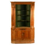 A large stripped pine corner cupboard, on cupboard base, circa 18th century,