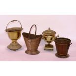 Three vintage coal depots, to include hammered copper example, together with a metal urn,