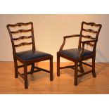 A set of 12 George III style mahogany ladder back chairs, including two carvers,