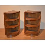 A pair of open bookcases, both with three tiers, which join to form larger bookcase,