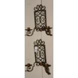 A pair of wrought iron wall mounting candle sconces from the Ardgowan Estate,