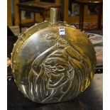 A large Oriental brass embossed moon shaped flask, with a figure to each side,